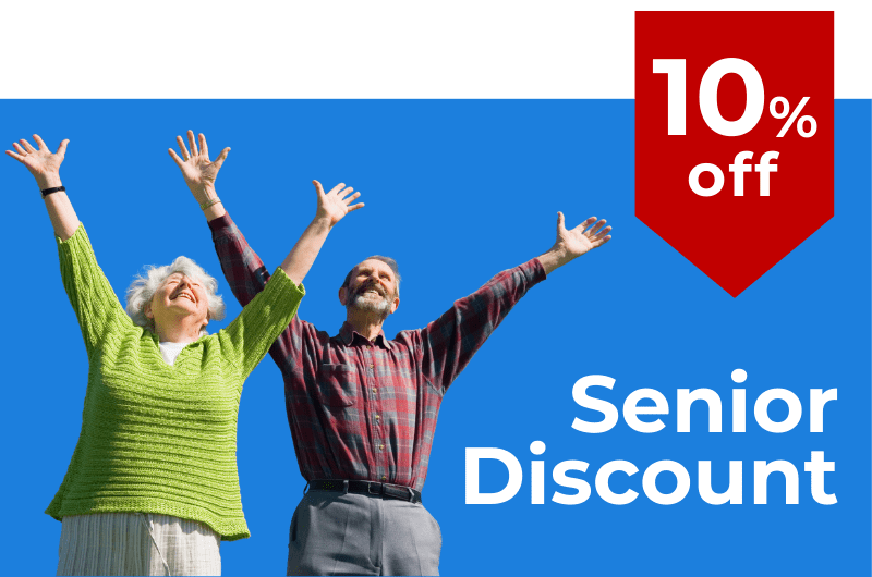 Happy senior couple celebrating with arms raised showcasing a 10 senior discount for maintenance and repair services Hand It To Us